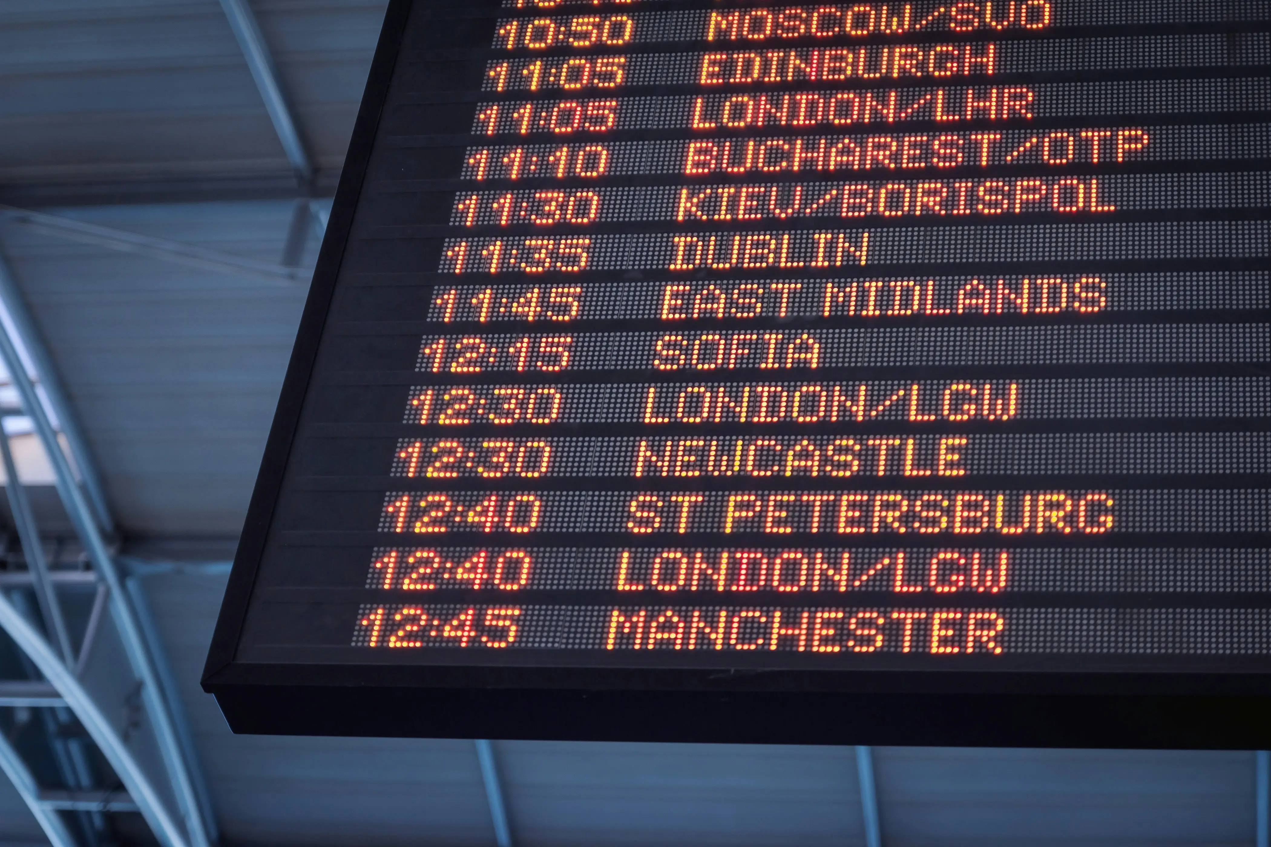 Real-time airport departure board displaying flight information