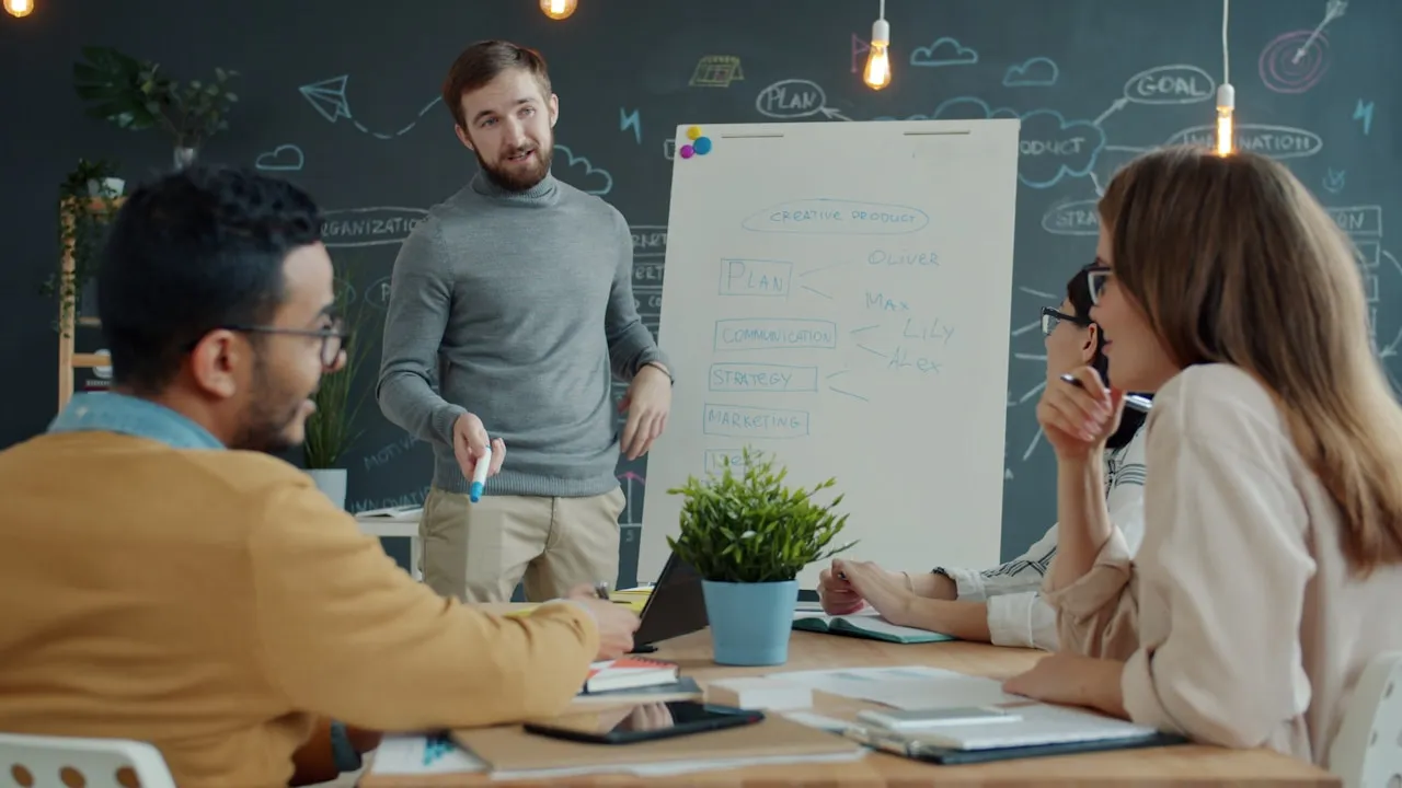 Team collaborating around a whiteboard during an enterprise planning session
